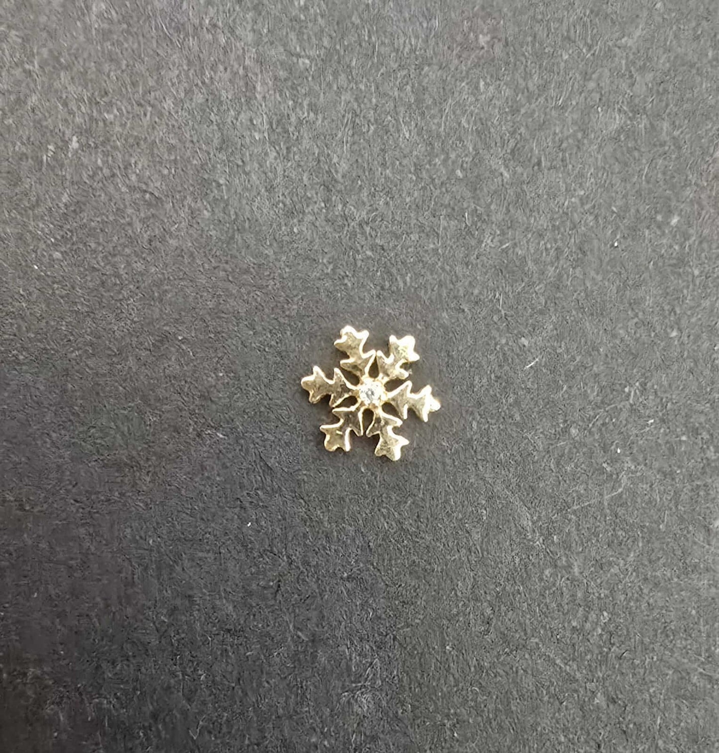gema dental oro 18k copo de nieve glowgems tooth gem